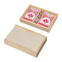 Playing cards in wooden box with dice